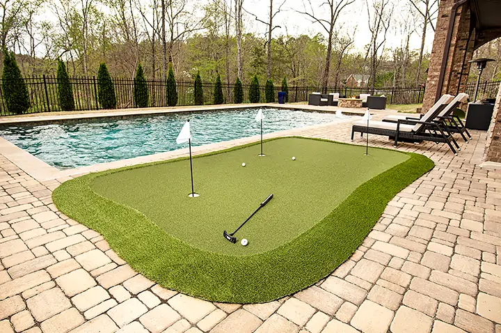 Backyard golf green pool area from SYNLawn